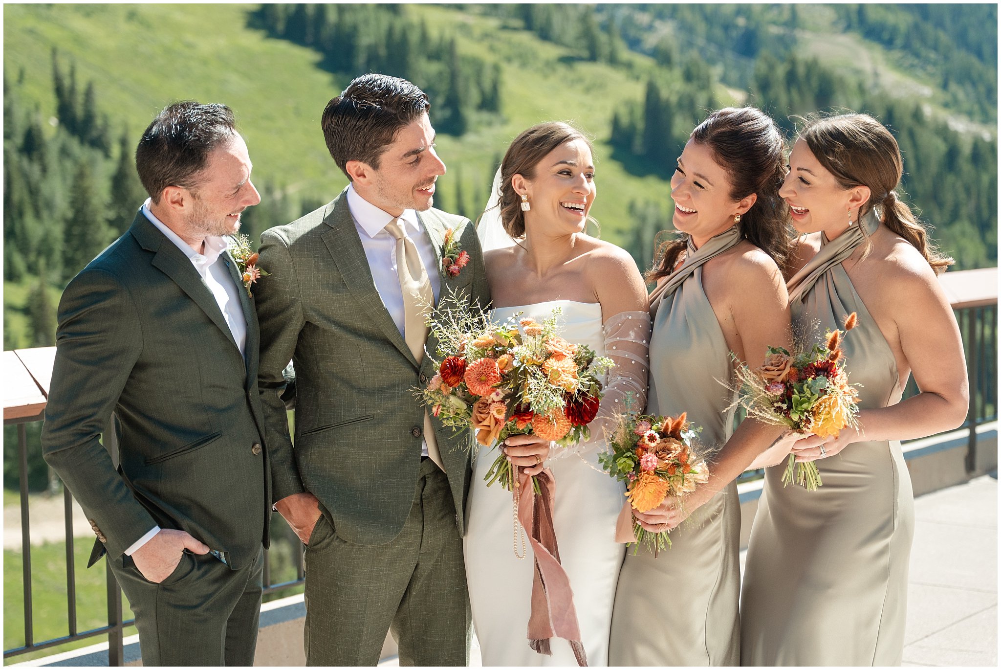 Wedding party in sage green on the rooftop of The Cliff Lodge. Groom wearing a sage green suit and golden tie, bride in a strapless dress with gloves and veil | Snowbird Summit Summer Wedding | Jessie and Dallin Photography