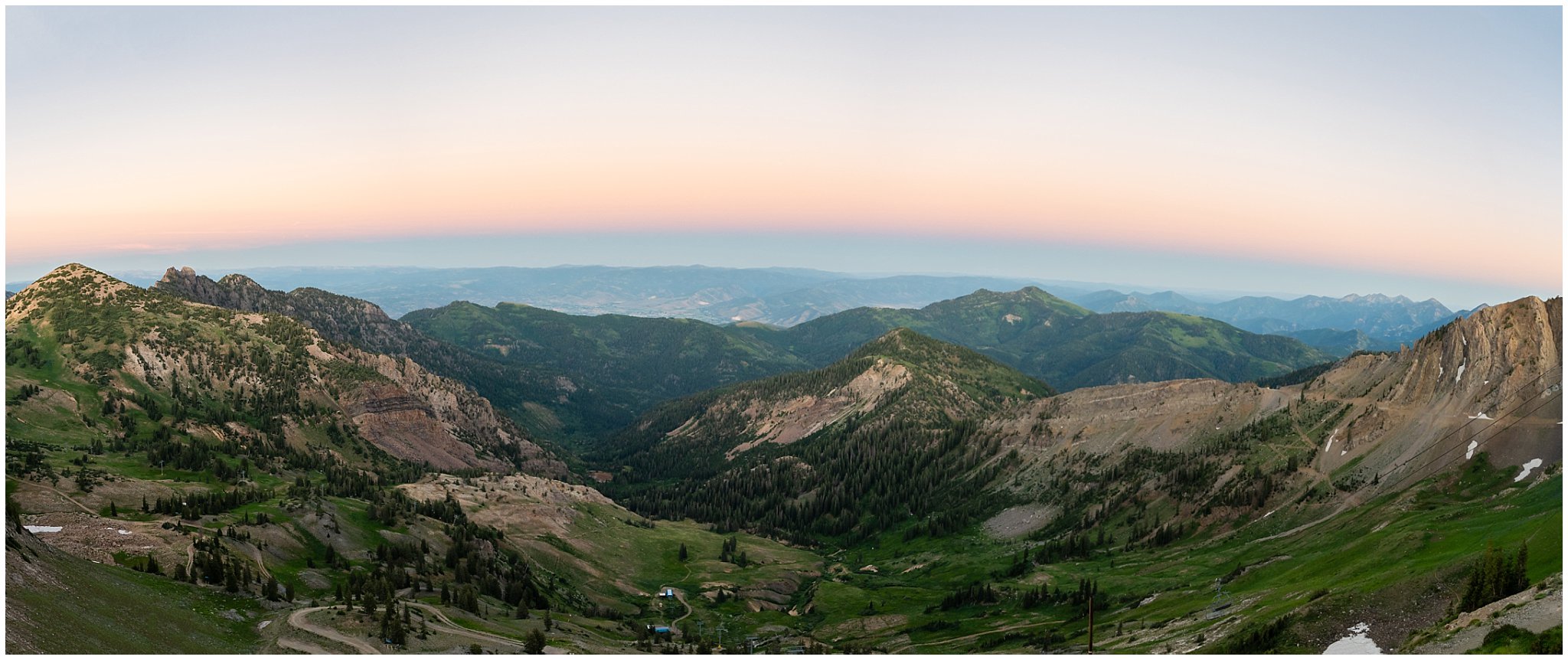 Panorama picture from the top of Snowbird of the mountain ranges at sunset | Snowbird Summit Summer Wedding | Jessie and Dallin Photography